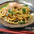 【ニラ入り醤油焼きうどん】仕上げのごま油と削り節がアクセント