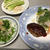 煮込みハンバーグ弁当。焼きハンバーグとサラダ