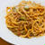 山菜の香りがソースに合う〜！庄内豚とうどのミートソーススパゲティ。