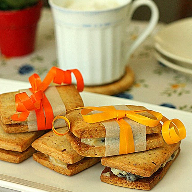 Almond Cookie Sandwiches with Rum Raisin Butter Cream