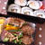 巻き寿司と中華ハンバーグ弁当