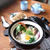 具だくさんの鍋焼きうどん と 三角いなり寿司。